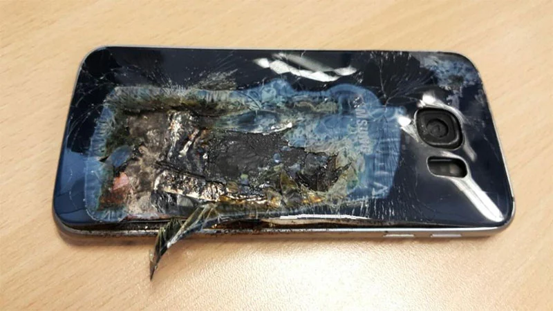 Damaged Samsung Galaxy smartphone on cell phone technician's desk at Ai Phone Repair Shop in Accra